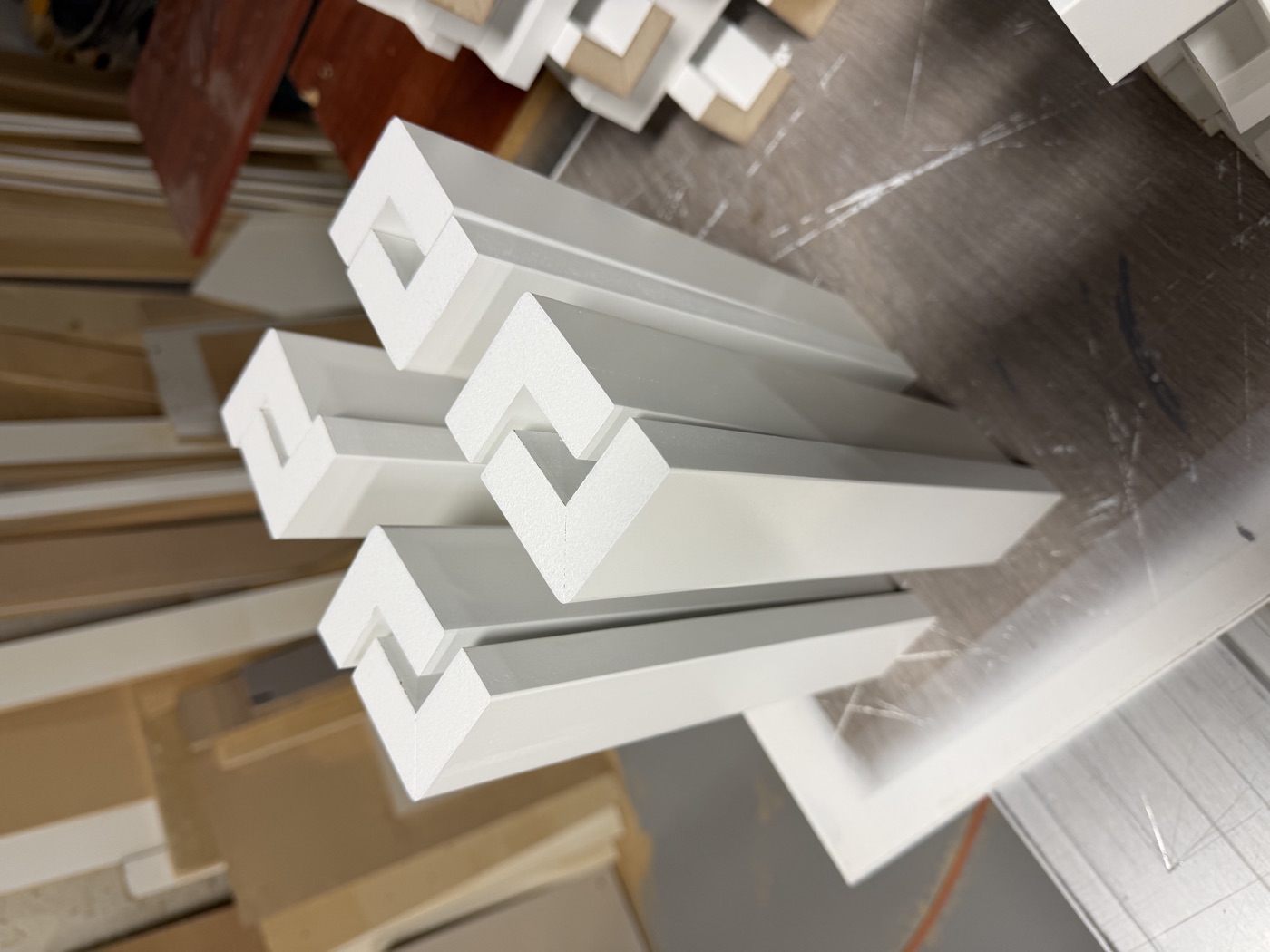 White finished components with routed profiles